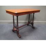 A Victorian mahogany table, the round cornered rectangular top over carved base and stretcher on
