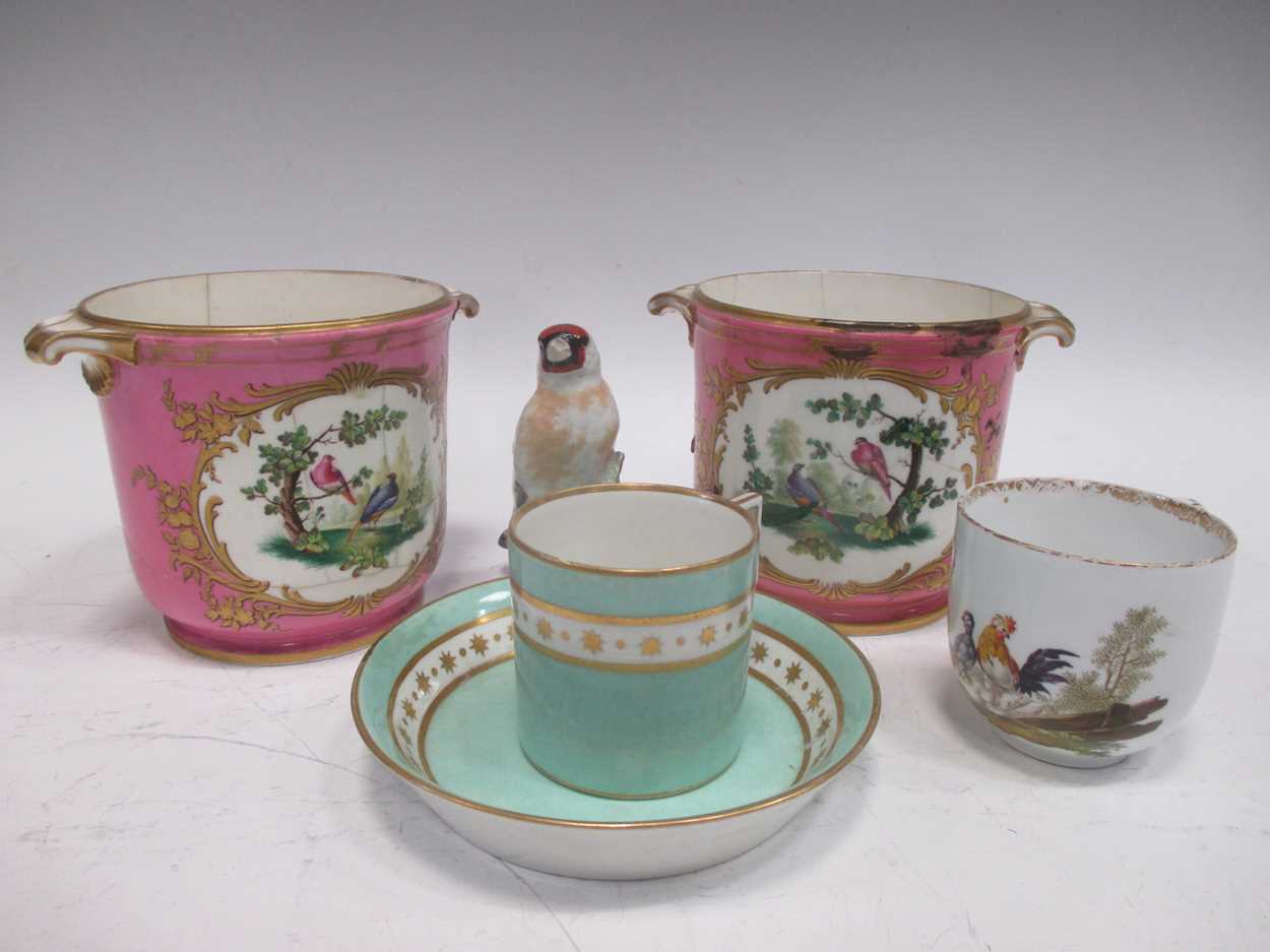 A pair of Sevres two-handled cache pots, painted with fanciful birds, reserved on pink ground