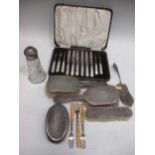A part fruit set with silver blades (lacking one fork), 4 dressing table brushes, glass body caster,