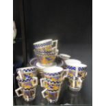 An aesthetic movement porcelain part tea and coffee service in the Japanesque manner the blue