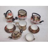A group of Royal Crown Derby miniature Imari porcelain, to include a watering can, kettle, teapot