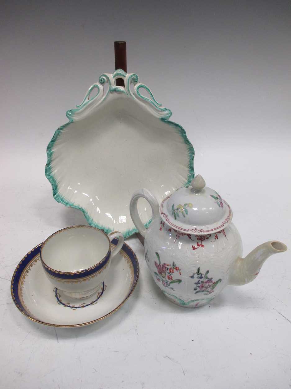 An 18th century English porcelain moulded teapot and associated cover, a Derby cup and saucer and