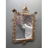 A carved and giltwood wall mirror, 100 x 63cmCondition report: Repairs.