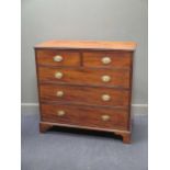A George III mahogany chest of drawers, fitted with two short and three long drawers, on bracket