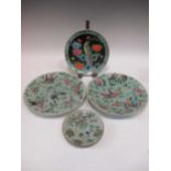 A pair of Chinese plates, the mint green bodies decorated with butterflies and flowers, a smaller