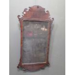 A George III style walnut fret carved wall mirror 104 x 54cm