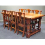 A reproduction oak dining suite: drawleaf table, 78 x 91 x 203cm (without leaves), 6 chairs,