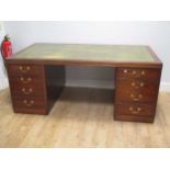 A mahogany twin pedestal desk,
