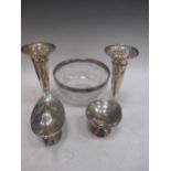 A pair of silver trumpet vases, an urn shaped sauce tureen, a small bon bon stand and a silver