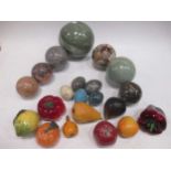 A collection of marble balls, the largest - 15cm wide; various pottery models of fruit