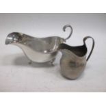 A Regency silver cream boat and a silver Edwardian sauceboat (2)