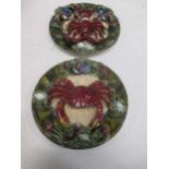 A pair of Portuguese Pallasy style majolica plates, one with a crab the other with a lobster stamped