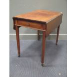 A Regency mahogany Pembroke table with shaped drop flaps, 81 x 52cm flaps down