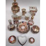 A group of Royal Crown Derby imari, to include a pair of miniature cabinet cups and a miniature