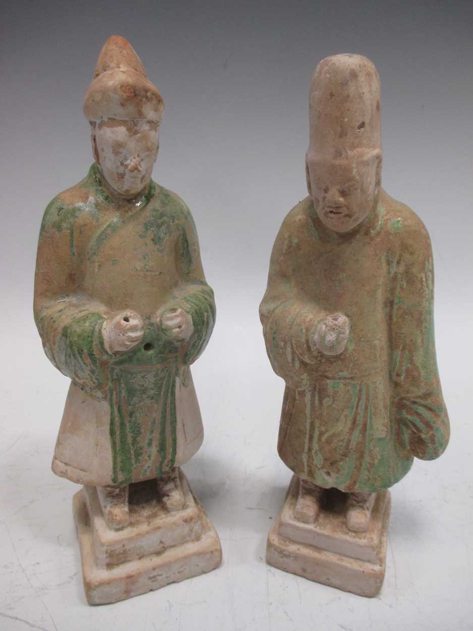 Two Chinese pottery figures, possibly Tang, each with remnants of green paint