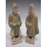 Two Chinese pottery figures, possibly Tang, each with remnants of green paint