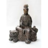 A Chinese bronze model of Guanyin,