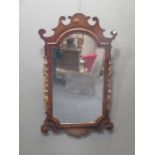 A George III style fret carved wall mirror with floral carved sides 96 x 58cm