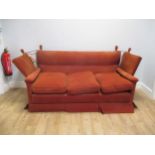 A red upholstered Knowle sofa, 190cm wide