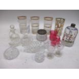 An assortment of glassware, including table lamp, cranberry glass jug, vases etc