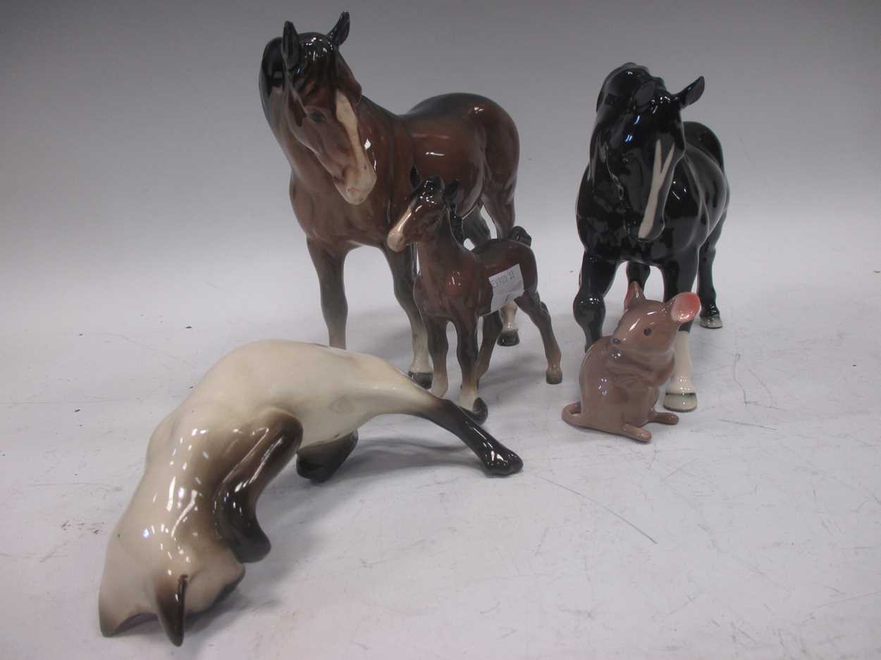 A collection of Beswick pottery animals to include a brown horse, a black horse marked VCC 2005, a