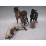 A collection of Beswick pottery animals to include a brown horse, a black horse marked VCC 2005, a