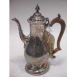 A silver coffee pot, baluster shape with wooden handle, 1953, 17ozt