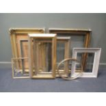 A collection of eight various gilt and painted picture frames, the largest with leaf tied reed