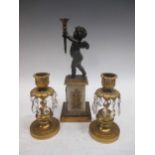 A bronze and gilt metal model of a cherub, on a marble base, 27cm high; a pair of 19th century