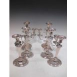 A pair of early 20th century silver plated three branch candlesticks of lyre form, 34cm high,