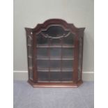 A 19th century Dutch oak hanging display cabinet with arched top and canted sides 99cm high 88cm
