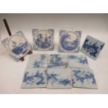 Seven 18th century Delft blue and white tiles decorated with grape vines and three Minton blue and