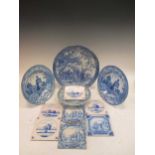 A quantity of blue and white plates, an egg stand, various Delft and other tiles and green leaf