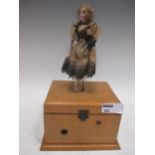 An early 20th century musical box with doll dancing figure to the lid