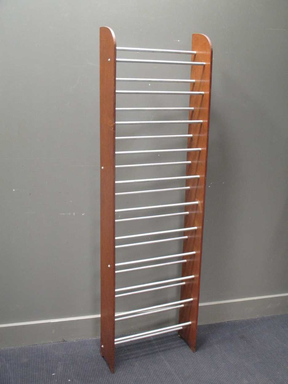 A modern oak and tubular metal shoe rack 179cm high and 52cm wide