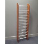 A modern oak and tubular metal shoe rack 179cm high and 52cm wide