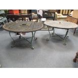 Two low garden tables formed from cart wheels on painted wrought iron bases, 63 x 120cm (2)