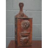 An oak candle box, applied with carved florets and shells, 53cm high