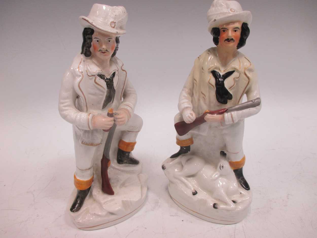 Pair of Staffordshire figures of huntsmen (one restored)