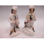 Pair of Staffordshire figures of huntsmen (one restored)