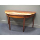 A continental rustic demi-lune fruitwood table, 74 x 137.5 x 67.5cm