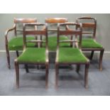 A set of five Regency mahogany rope back dining chairs to include two carvers, with green