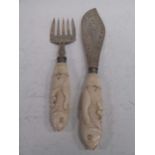 A pair of aesthetic movement silver fish servers, the large blade and fork pierced decorated with