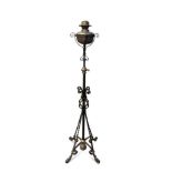 An Arts & Crafts copper and wrought iron standard lamp in the manner of W/.A.S Benson,