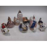 A group of Royal Crown Derby paperweights to include a pig, swan, penguin, snail, cock, chicken,