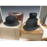 An early 20th century Herbert Johnson silk top hat, internal diameter 19 x 6cm oval, two bowler hats
