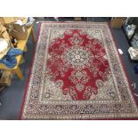 A red ground North West Persian style rug 385 x 280cm