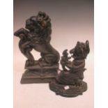 A 19th century cast iron doorstop in the form of a rampant lion resting on a shield, 37cm high