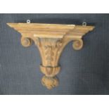 A carved pine wall bracket