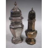 Two silver sugar shakers, the larger London 1925, 11.4ozt